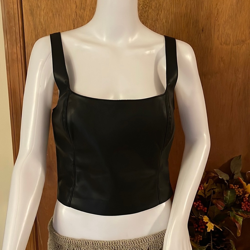 Leather like camisole top with a side, zipper and the adjustable button
